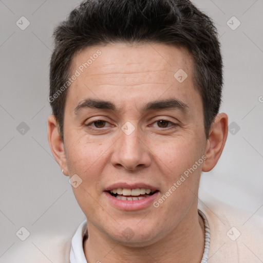 Joyful white adult male with short  brown hair and brown eyes