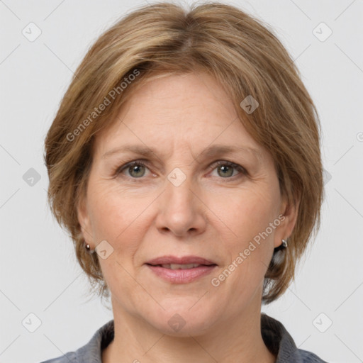 Joyful white adult female with medium  brown hair and grey eyes