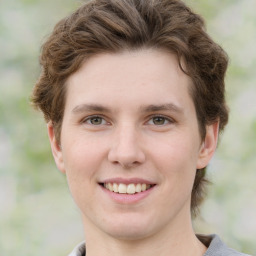 Joyful white young-adult female with medium  brown hair and green eyes