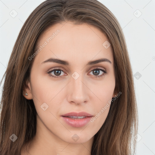 Neutral white young-adult female with long  brown hair and brown eyes