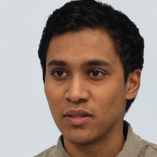 Neutral latino young-adult male with short  black hair and brown eyes