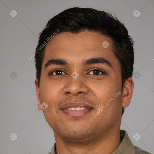 Joyful latino young-adult male with short  black hair and brown eyes