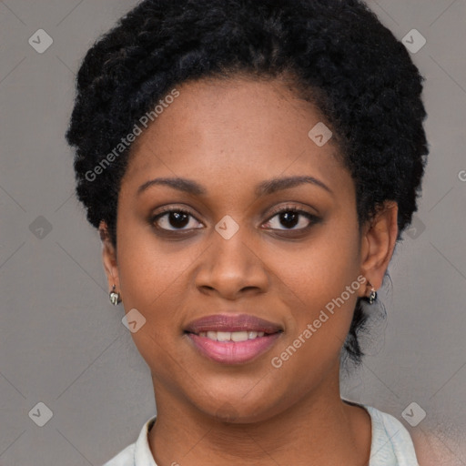 Joyful black young-adult female with short  black hair and brown eyes