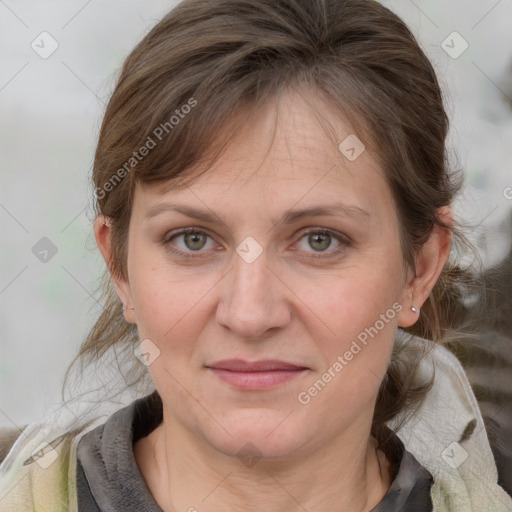 Joyful white adult female with medium  brown hair and grey eyes