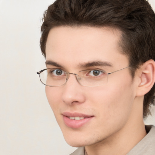 Joyful white young-adult male with medium  brown hair and brown eyes