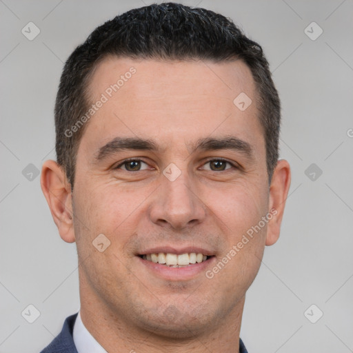 Joyful white young-adult male with short  brown hair and brown eyes