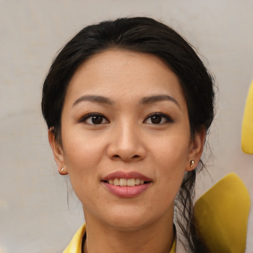 Joyful asian young-adult female with medium  brown hair and brown eyes