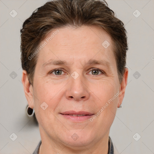 Joyful white adult male with short  brown hair and grey eyes