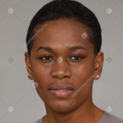 Joyful black young-adult female with short  black hair and brown eyes