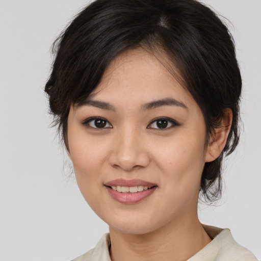 Joyful white young-adult female with medium  brown hair and brown eyes
