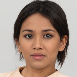 Neutral asian young-adult female with medium  brown hair and brown eyes