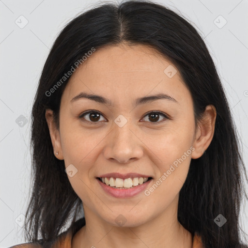 Joyful latino young-adult female with long  brown hair and brown eyes