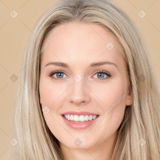 Joyful white young-adult female with long  brown hair and blue eyes