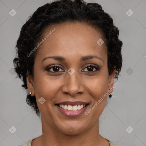 Joyful black adult female with short  brown hair and brown eyes