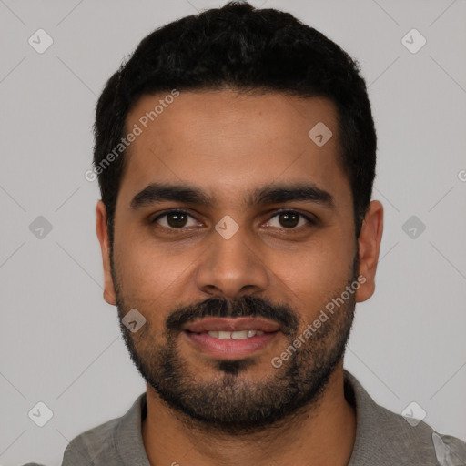 Joyful latino young-adult male with short  black hair and brown eyes