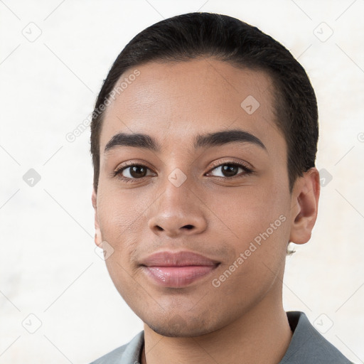 Joyful white young-adult male with short  black hair and brown eyes