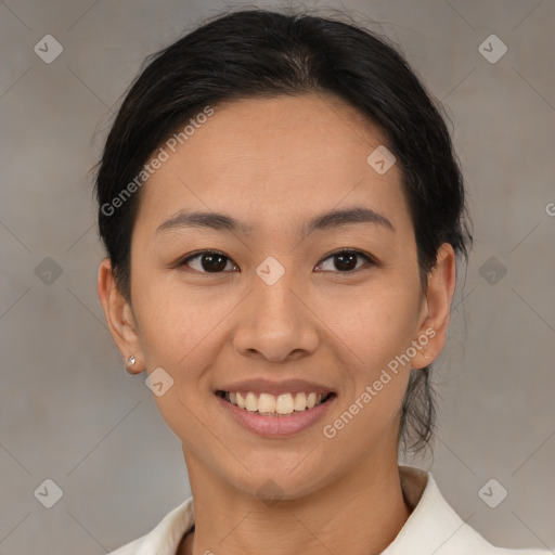Joyful asian young-adult female with medium  brown hair and brown eyes