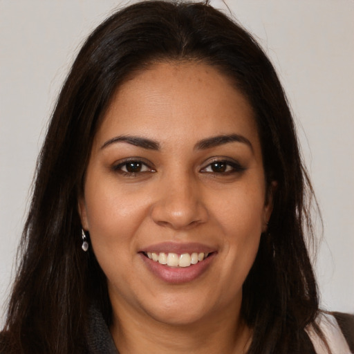 Joyful white young-adult female with long  brown hair and brown eyes