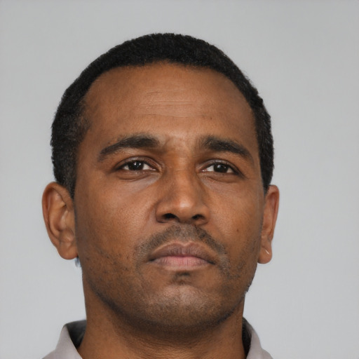 Neutral black young-adult male with short  brown hair and brown eyes