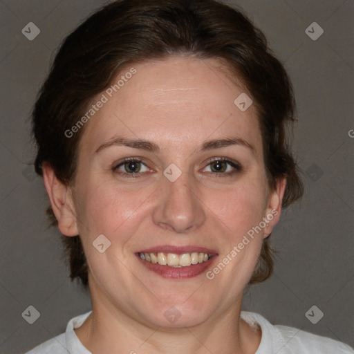 Joyful white adult female with short  brown hair and brown eyes