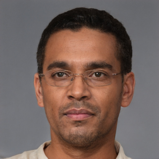 Neutral latino adult male with short  black hair and brown eyes