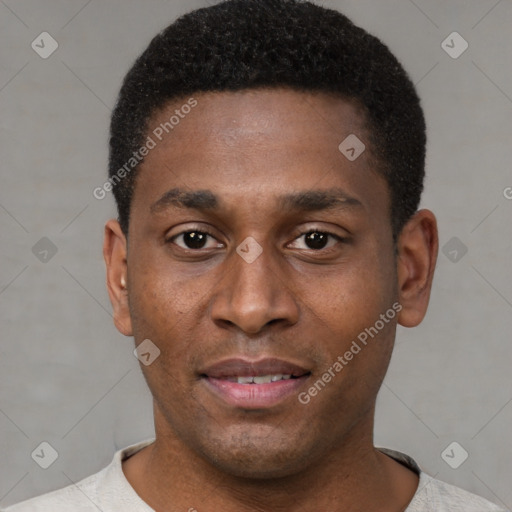 Joyful black young-adult male with short  black hair and brown eyes