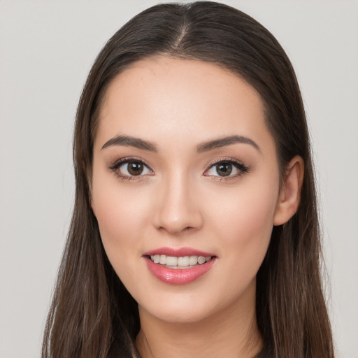 Joyful white young-adult female with long  brown hair and brown eyes