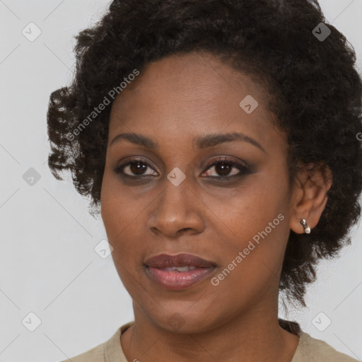 Joyful black young-adult female with medium  brown hair and brown eyes