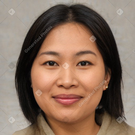 Joyful asian young-adult female with medium  brown hair and brown eyes