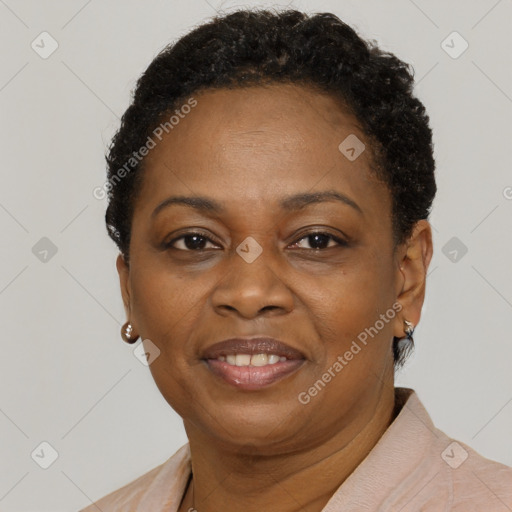 Joyful black adult female with short  brown hair and brown eyes