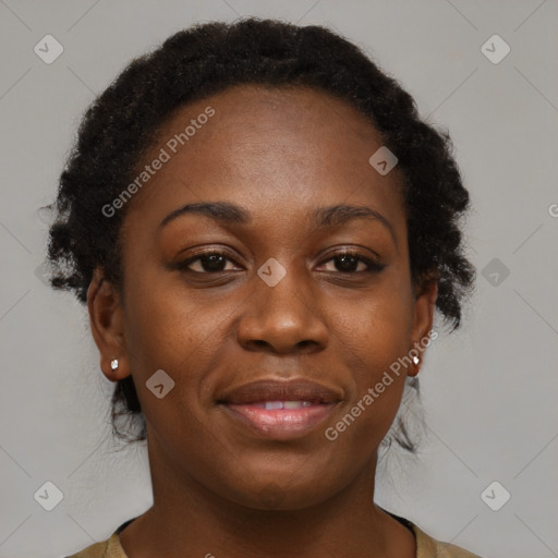 Joyful black adult female with medium  brown hair and brown eyes