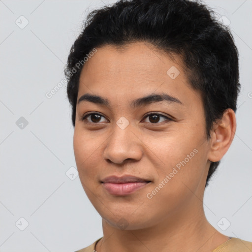 Joyful latino young-adult female with short  brown hair and brown eyes