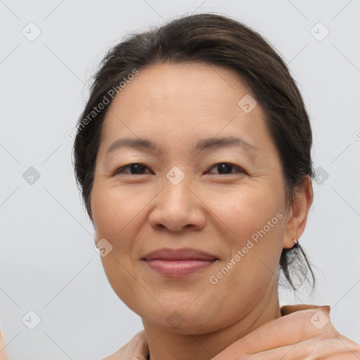 Joyful white adult female with short  brown hair and brown eyes