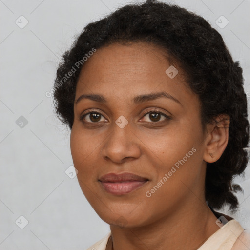 Joyful black young-adult female with short  brown hair and brown eyes