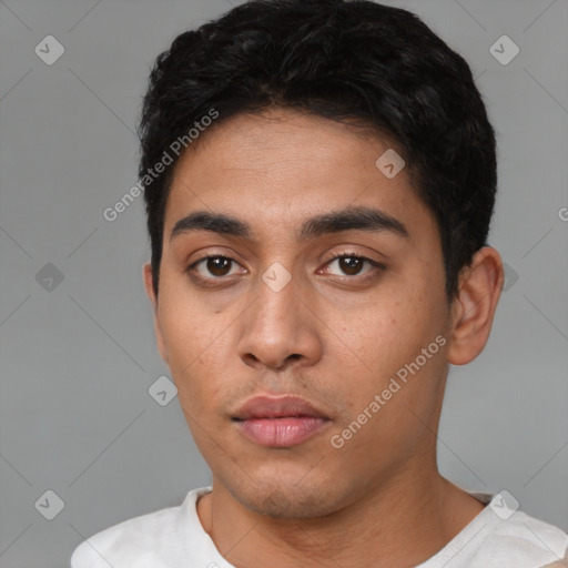 Neutral latino young-adult male with short  black hair and brown eyes