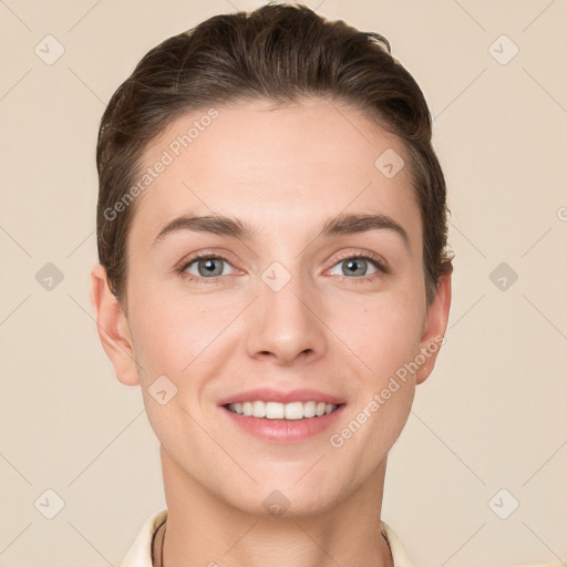 Joyful white young-adult female with short  brown hair and grey eyes