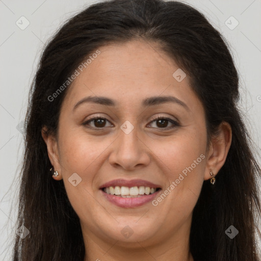 Joyful white adult female with long  brown hair and brown eyes