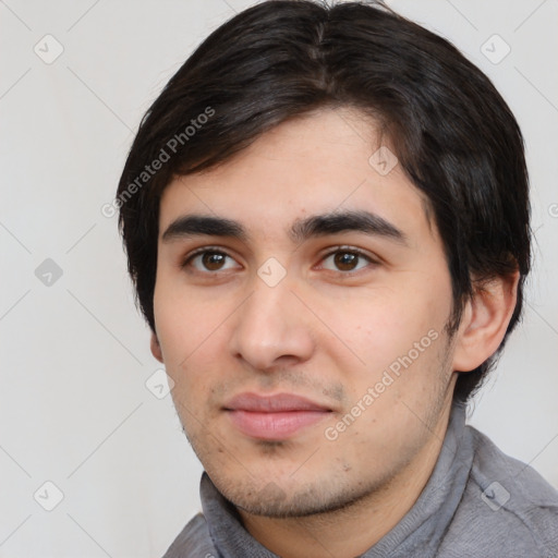 Joyful white young-adult male with short  black hair and brown eyes