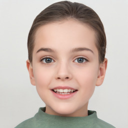 Joyful white child female with short  brown hair and brown eyes