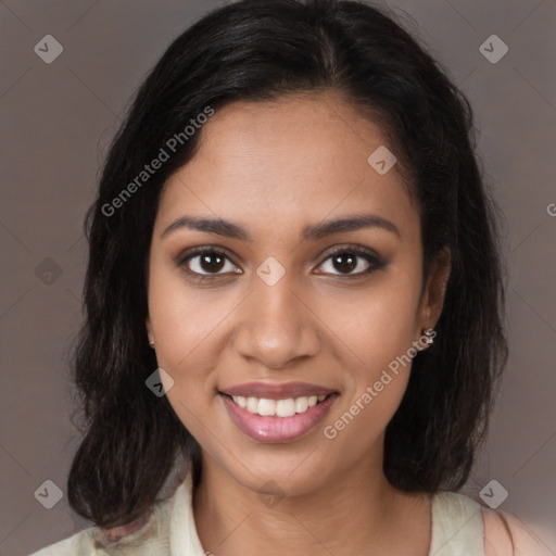 Joyful black young-adult female with medium  brown hair and brown eyes