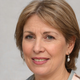 Joyful white adult female with medium  brown hair and grey eyes