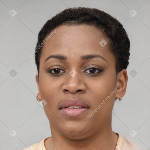 Joyful black young-adult female with short  brown hair and brown eyes