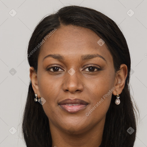 Joyful black adult female with long  brown hair and brown eyes