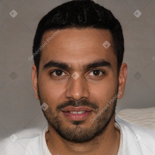 Joyful latino young-adult male with short  black hair and brown eyes