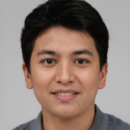 Joyful asian young-adult male with short  black hair and brown eyes