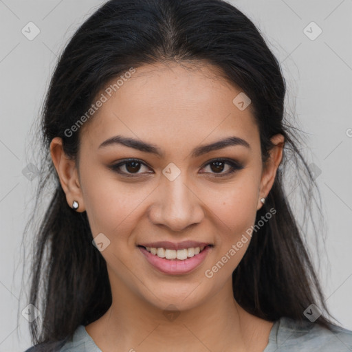 Joyful latino young-adult female with long  brown hair and brown eyes