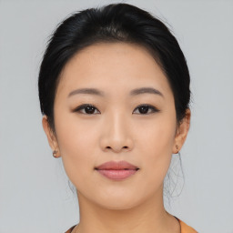 Joyful asian young-adult female with medium  black hair and brown eyes