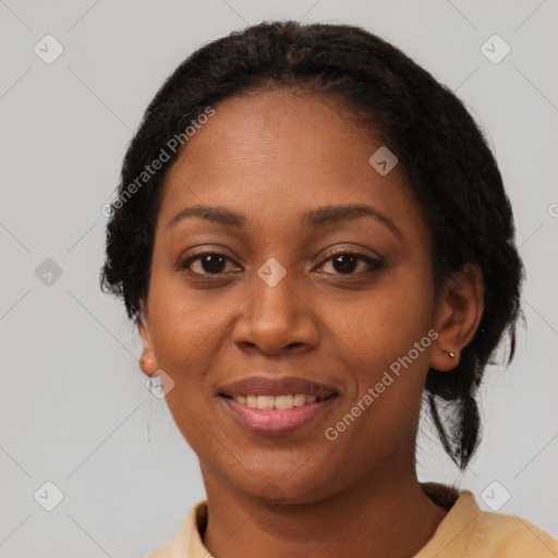 Joyful black adult female with medium  brown hair and brown eyes