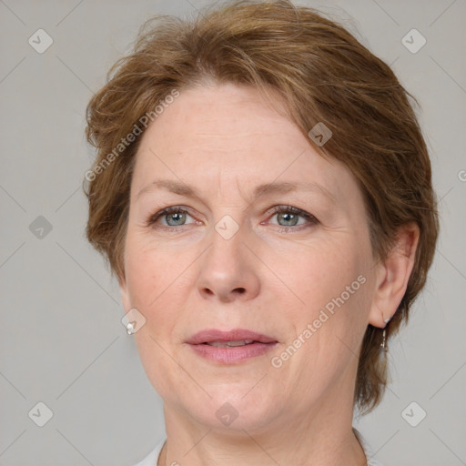 Joyful white adult female with medium  brown hair and grey eyes