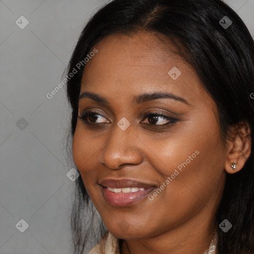 Joyful latino young-adult female with long  black hair and brown eyes